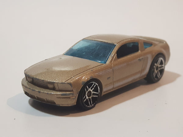 2007 Hot Wheels 2005 Ford Mustang GT Champagne Gold Die Cast Toy Car Vehicle