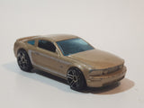 2007 Hot Wheels 2005 Ford Mustang GT Champagne Gold Die Cast Toy Car Vehicle