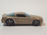 2007 Hot Wheels 2005 Ford Mustang GT Champagne Gold Die Cast Toy Car Vehicle