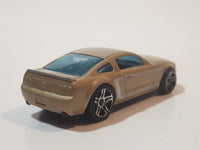 2007 Hot Wheels 2005 Ford Mustang GT Champagne Gold Die Cast Toy Car Vehicle