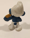 Vintage Peyo Bully Schleich Smurf With Biscuit Cookie 1 7/8" Tall PVC Toy Figure Made in West Germany