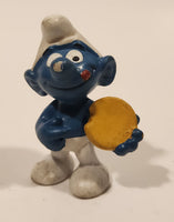 Vintage Peyo Bully Schleich Smurf With Biscuit Cookie 1 7/8" Tall PVC Toy Figure Made in West Germany