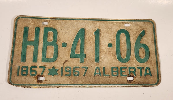 Vintage 1967 Alberta 1867-1967 Centennial Green Letters White Vehicle License Plate Tag HB 41 06