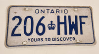 1986 to 1994 Ontario Yours To Discover White with Blue Letters Vehicle License Plate 206 HWF