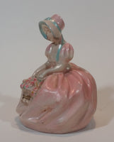 Vintage Chalkware Sitting Girl in Victorian Pink Dress with Bonnet and Flower Basket Figurine - Treasure Valley Antiques & Collectibles