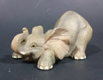 Elephant Figurine Laying Down with Trunk Upwards Marked ©97 WUI - Treasure Valley Antiques & Collectibles