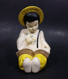 Vintage Chalkware Asian Child in Yellow Hat Sitting and Reading a Book Figurine - Treasure Valley Antiques & Collectibles