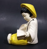 Vintage Chalkware Asian Child in Yellow Hat Sitting and Reading a Book Figurine - Treasure Valley Antiques & Collectibles