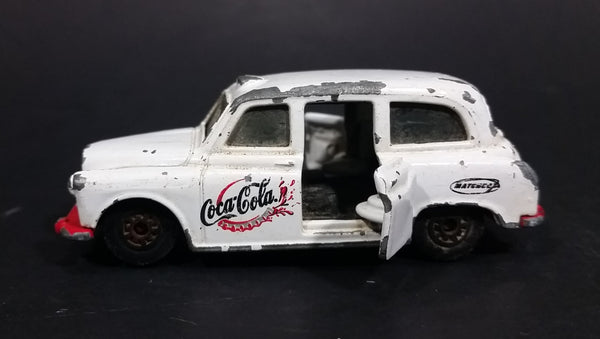 1985-1986 Matchbox Mattel Coca-Cola Coke Taxi FX4R with Suicide Doors Diecast Toy Car - Treasure Valley Antiques & Collectibles