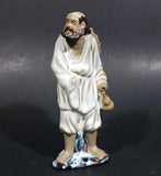 Vintage Balding Man with a Beard in a White Robe With a Tan Hat Ceramic Figurine - Treasure Valley Antiques & Collectibles