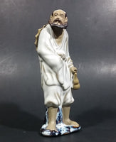 Vintage Balding Man with a Beard in a White Robe With a Tan Hat Ceramic Figurine - Treasure Valley Antiques & Collectibles