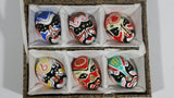 Vintage Set of 6 Hand Painted Miniature Chinese Colored Clay Mud Opera Masks In Light Brown Patterned Hinged Silk Lined Box