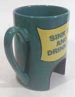 1998 Warner Bros Looney Tunes Taz Tasmanian Devil Cartoon Character "Sink It and Drink It!" Dark Green Ceramic Coffee Mug with Hole For Golf Ball Underneath