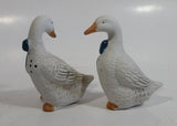 1990s Pair of White Goose Geese with Blue Bows Ceramic Salt and Pepper Shakers