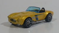 2012 Hot Wheels Shelby Classic Cobra Convertible Metalflake Light Gold Die Cast Toy Car Vehicle w/ Opening Hood