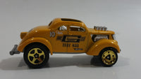 2010 Hot Wheels HW Performance Pass'n Gasser Yellow Gold Die Cast Toy Race Car Vehicle