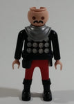 1993 Geobra Playmobil No Hair Knight in Red Bottoms Black Top with Silver Dots and collar  3" Tall Toy Figure Wearing a Holster