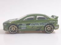 2010 Hot Wheels Nightburnerz 2008 Lancer Evolution Metallic Green Die Cast Toy Car Vehicle