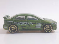 2010 Hot Wheels Nightburnerz 2008 Lancer Evolution Metallic Green Die Cast Toy Car Vehicle