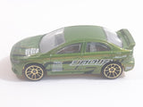 2010 Hot Wheels Nightburnerz 2008 Lancer Evolution Metallic Green Die Cast Toy Car Vehicle