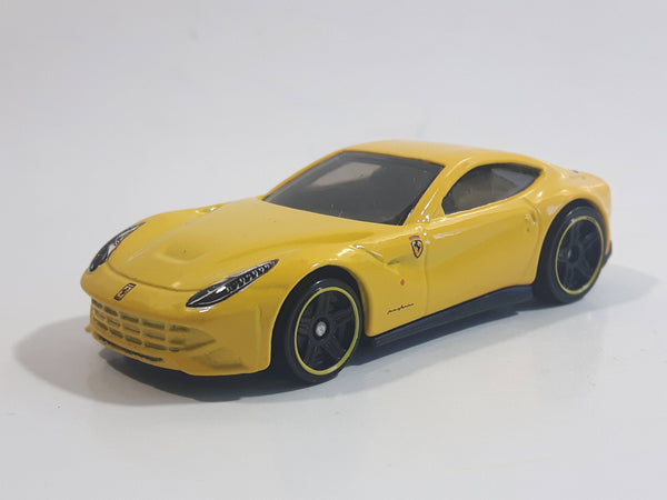 2014 Hot Wheels HW City - Speed Team Ferrari F12 Berlinetta Yellow Die Cast Toy Car Vehicle