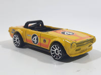 2011 Hot Wheels Track Stars Triumph TR6 Yellow #4 Die Cast Toy Race Car Vehicle