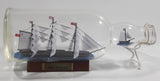 Vintage Highly Detailed HMS Surprise British Flagged Captured French Naval Tall Ship with Small Skiff Life Boat Sail Boat in 10 1/4" Long Glass Bottle