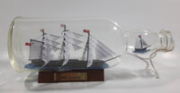 Vintage Highly Detailed HMS Surprise British Flagged Captured French Naval Tall Ship with Small Skiff Life Boat Sail Boat in 10 1/4" Long Glass Bottle