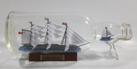 Vintage Highly Detailed HMS Surprise British Flagged Captured French Naval Tall Ship with Small Skiff Life Boat Sail Boat in 10 1/4" Long Glass Bottle