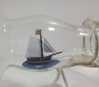 Vintage Highly Detailed HMS Surprise British Flagged Captured French Naval Tall Ship with Small Skiff Life Boat Sail Boat in 10 1/4" Long Glass Bottle