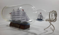 Vintage Highly Detailed HMS Surprise British Flagged Captured French Naval Tall Ship with Small Skiff Life Boat Sail Boat in 10 1/4" Long Glass Bottle