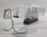 Vintage Highly Detailed HMS Surprise British Flagged Captured French Naval Tall Ship with Small Skiff Life Boat Sail Boat in 10 1/4" Long Glass Bottle