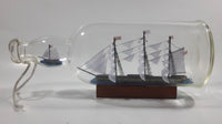 Vintage Highly Detailed HMS Surprise British Flagged Captured French Naval Tall Ship with Small Skiff Life Boat Sail Boat in 10 1/4" Long Glass Bottle