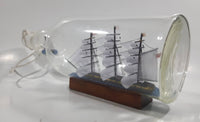 Vintage Highly Detailed HMS Surprise British Flagged Captured French Naval Tall Ship with Small Skiff Life Boat Sail Boat in 10 1/4" Long Glass Bottle