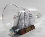 Vintage Highly Detailed HMS Surprise British Flagged Captured French Naval Tall Ship with Small Skiff Life Boat Sail Boat in 10 1/4" Long Glass Bottle