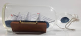 Vintage Highly Detailed HMS Surprise British Flagged Captured French Naval Tall Ship with Small Skiff Life Boat Sail Boat in 10 1/4" Long Glass Bottle