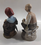 Old Man Sitting With Keg Barrel and Beer Stein and Old Woman Sitting with Umbrella and Packages Porcelain Figurines Set of 2