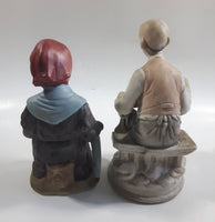 Old Man Sitting With Keg Barrel and Beer Stein and Old Woman Sitting with Umbrella and Packages Porcelain Figurines Set of 2