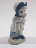 Vintage Blue and White Delft Style Girl Holding Puppy Porcelain Figure 3 3/4" Tall