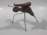 Yukon Mosquito Pine Cone and Wood Art Figure 5 1/4" Long