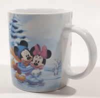 Enesco Disney Mickey Mouse, Minnie Mouse, Goofy, and Pluto Winter Scene Ice Skating on A Pond 3 3/4" Tall Ceramic Coffee Mug Cup