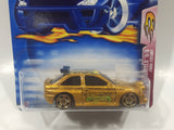 2003 Hot Wheels Flamin' Hot Wheels Ford Escort Metalflake Gold Die Cast Toy Car Vehicle New in Package