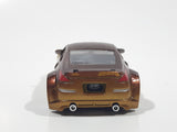 ERTL Joy Ride Universal Studios Fast and Furious Tokyo Drift 2006 Nissan 350Z Gold and Brown Die Cast Toy Car Vehicle Missing Tires 3 1/4" Long