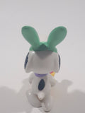 United Feature Peanuts Snoopy Easter Bunny Pushing Wheelbarrow Of Eggs with Woodstock 2 3/4" Tall PVC Toy Figure