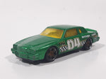 2010 Hot Wheels Race World Movie Stunts '84 Pontiac Grand Prix Metallic Green Die Cast Toy Car Vehicle