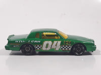 2010 Hot Wheels Race World Movie Stunts '84 Pontiac Grand Prix Metallic Green Die Cast Toy Car Vehicle