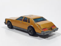 Vintage 1983 Hot Wheels Cadillac Seville Metalflake Gold Die Cast Toy Car Vehicle