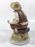 Vintage Man and Woman Sitting Holding Flowers 6 1/4" Tall Porcelain Figurine