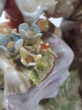 Vintage Man and Woman Sitting Holding Flowers 6 1/4" Tall Porcelain Figurine