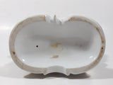 Vintage Man and Woman Sitting Holding Flowers 6 1/4" Tall Porcelain Figurine